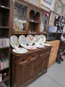 An oak dresser with lead glazed doors, one glass a/f.