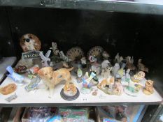 A shelf of animal figures including Cooper craft dog,. Goebel etc.