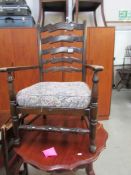 An oak arm chair.