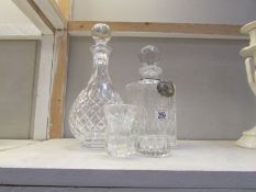 2 glass decanters and other glass ware.