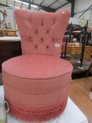 A pink bedroom chair.