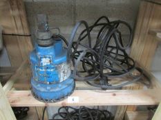 A submersible electric water pump.