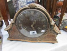A Westminster chime mantel clock with original pendulum and key.