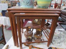 A nest of 3 tiled top tables.