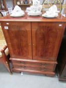 A yew wood effect cabinet,.