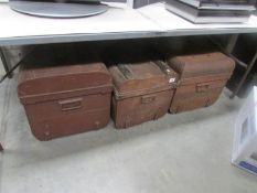3 old tin trunks.