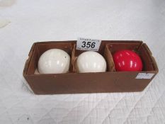 3 vintage billiard balls.