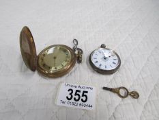 A ladies white metal fob watch a/f and a brass full hunter pocket watch with key a/f.