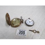 A ladies white metal fob watch a/f and a brass full hunter pocket watch with key a/f.