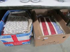 2 boxes of assorted fabrics.