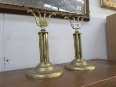 A pair of Victorian brass fire dogs.