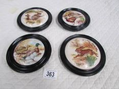 4 framed and glazed animal pot lids.