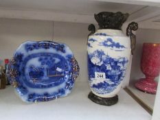 A blue and white vase and a flo blue dish,.