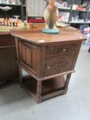 An oak hall cabinet.