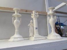 A pair of Royal Cream ware candlesticks and one other.