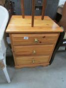 A pine 3 drawer chest.