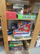A collection of vintage and modern board games including Sherlock Holmes, The Dickens Game, Subbuteo