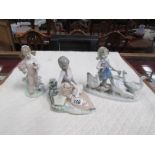 2 Lladro figures and one other.