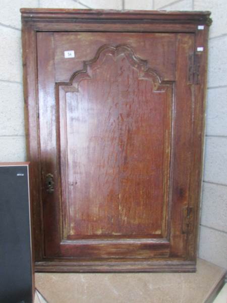 An oak corner cupboard.