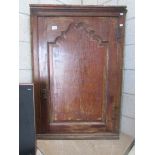 An oak corner cupboard.