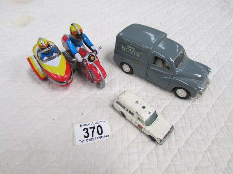 A Chinese Morris Minor van, A Matchbox Mercedes Benz, and a tin plate motorcycle with sidecar.