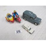 A Chinese Morris Minor van, A Matchbox Mercedes Benz, and a tin plate motorcycle with sidecar.