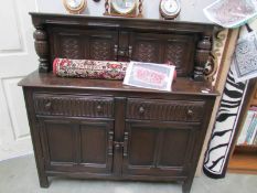 An oak court cupboard.