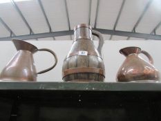 2 copper jugs and one other.