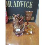 A pair of Cornish 'Foster's Pottery' gurgle jugs, an amber glass vase and a 1950's amber glass jug.