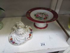 A porcelain ink well and a cake stand.