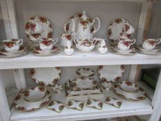 Approximately 50 pieces of Royal Albert Old Country Roses tea and dinnerware together with 2 sets