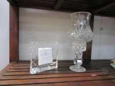 A cut glass candle lamp and a Royal Doulton glass photo frame.