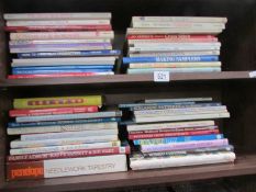 2 shelves of books on quilting, embroidery, knitting etc.