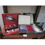 A cased set of fish knives and forks, cased set of butter knives and cased dessert cutlery set.
