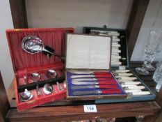 A cased set of fish knives and forks, cased set of butter knives and cased dessert cutlery set.