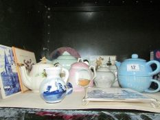 A mixed lot of teapots, teapot stands etc.