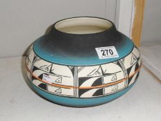 A signed Zuni pottery bowl.