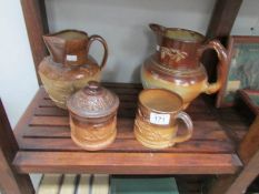 2 Stoneware jugs, a tobacco jar and a tankard.