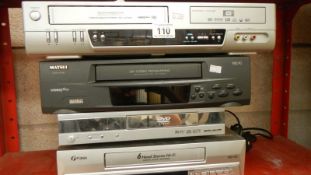 4 VHS recorders and a DVD player.
