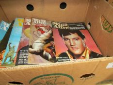 A box of Mind Alive magazines.