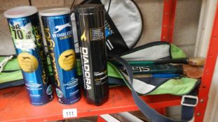 2 tennis raquets and balls.