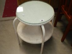 A wicker table with glass top.