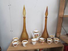 A Bavarian coffee set and a pair of amber coloured glass decanters.