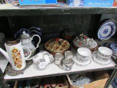 A shelf of miscellaneous including pie dishes, coffee pots etc.