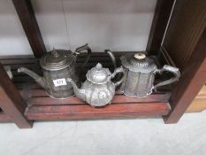 3 silver plated teapots.