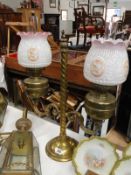 A double brass oil lamp with shades.