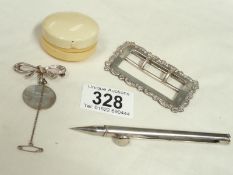 A silver buckle, a silver brooch and 2 other items.