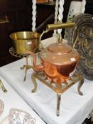 A copper kettle, a brass saucepan and 2 brass trivets.