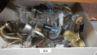 A box of glass wall light parts.