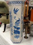 A blue and white ceramic stick stand.